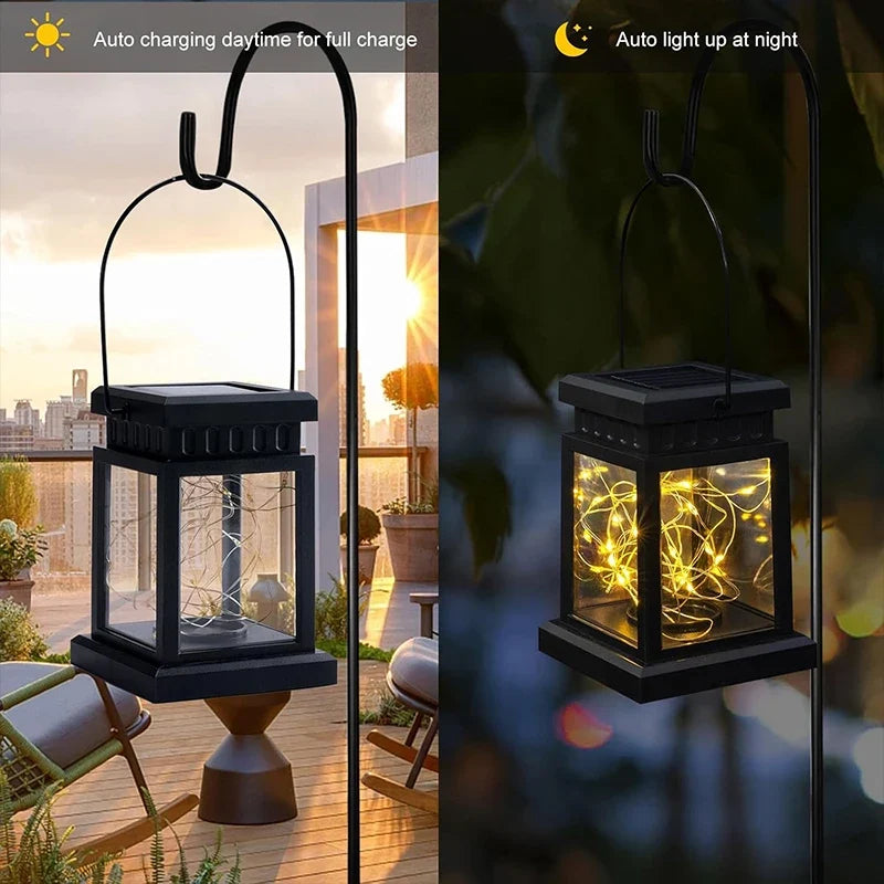 Pair of black solar lanterns with arched handles, warm light glowing in night settings