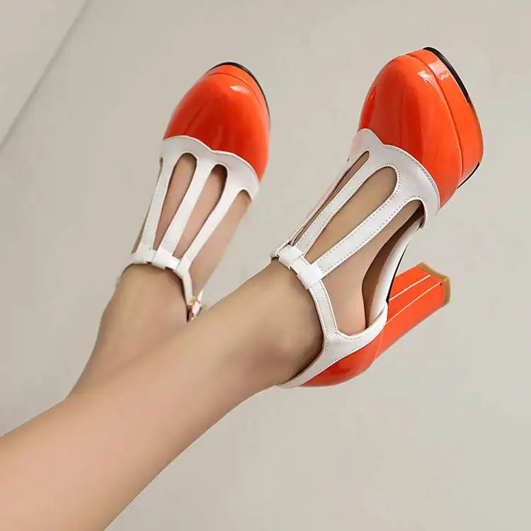 Pair of red-and-white high-heel Mary Jane shoes with cutout toe straps
