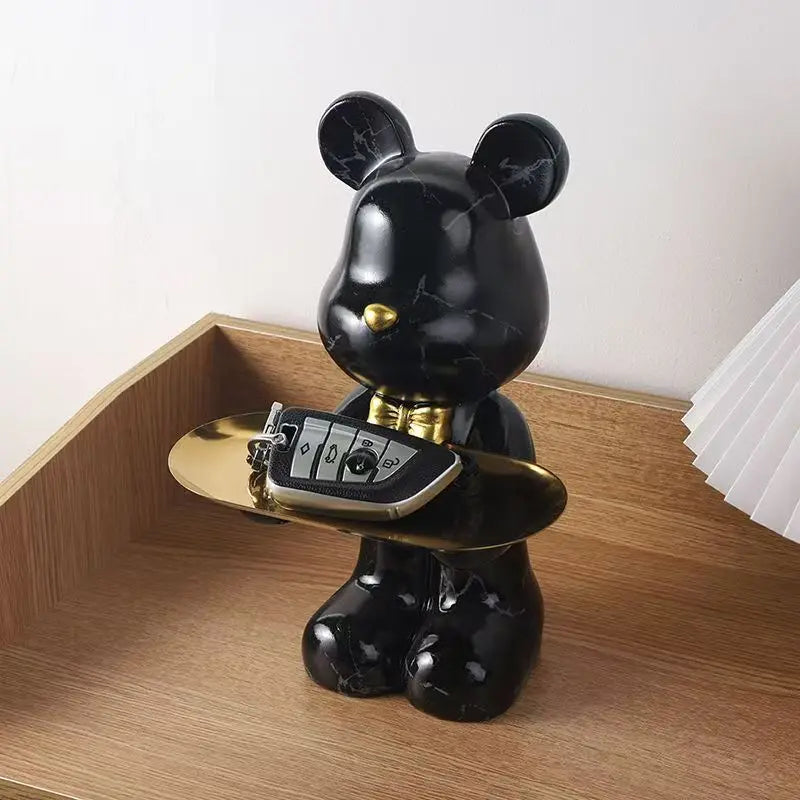 Black resin standing bear storage statue with gold tray holding a phone