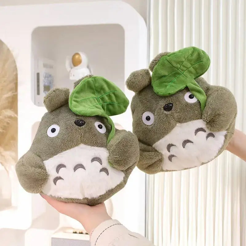 Cartoon forest creature plush pillows, brown plush with green leaf caps on a couch