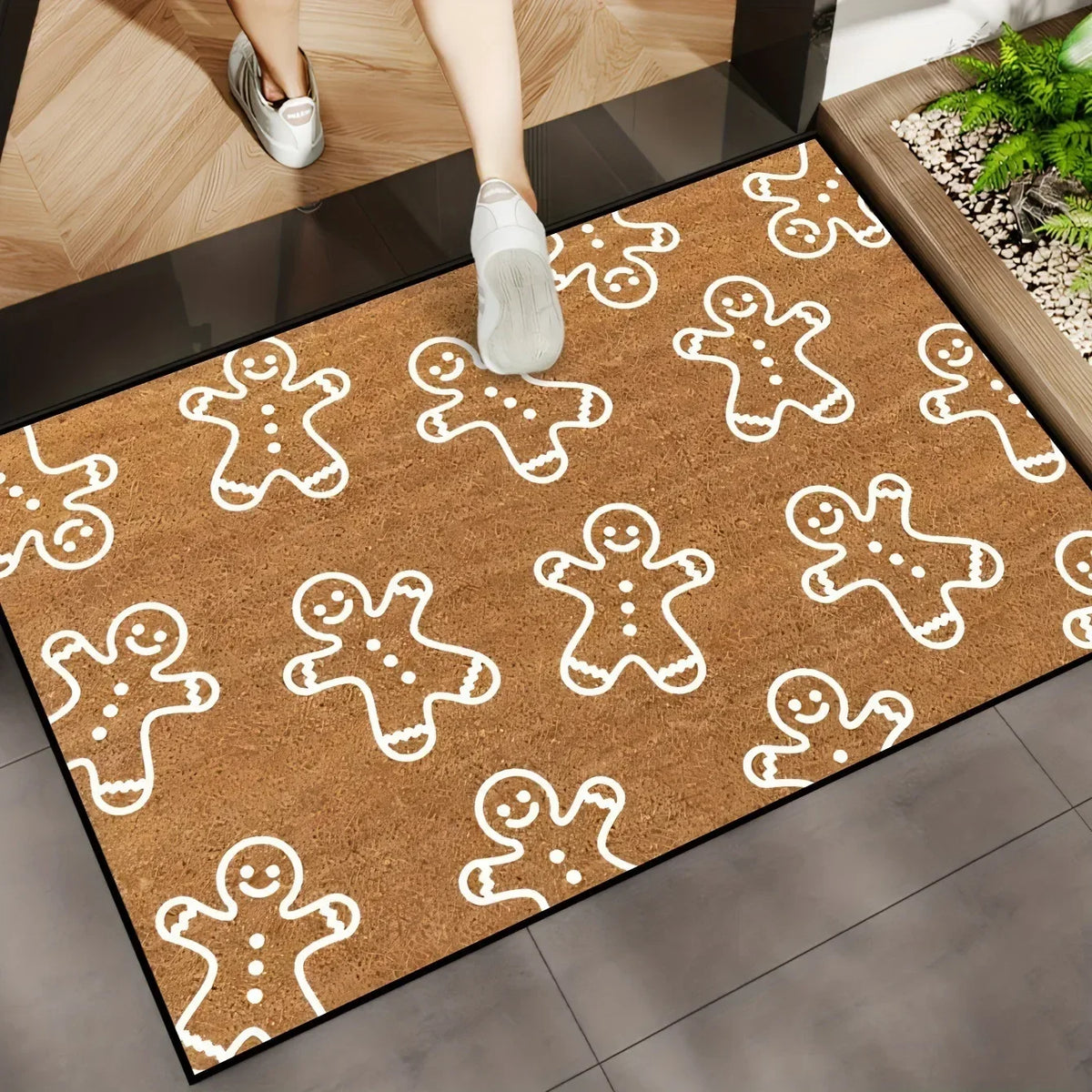 Cork-brown doormat with white gingerbread men outline pattern