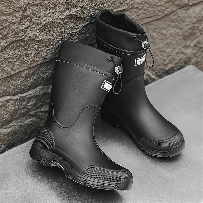 Women's mid-calf rain boots in black rubber with side panel and drawstring cuff