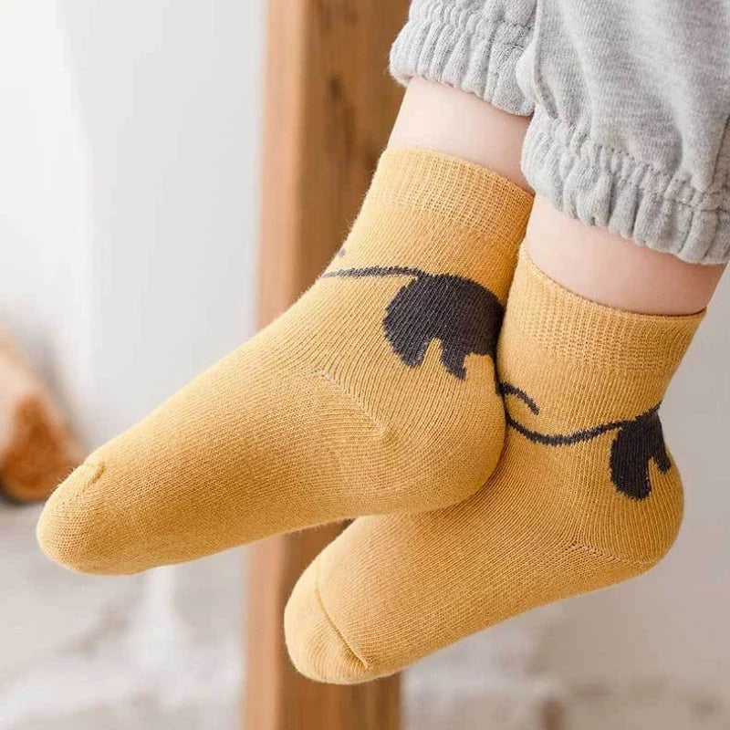 Kids cartoon cat crew socks, golden yellow pair with black cat graphic