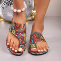 Women’s boho flat printed slippers with pearl ankle beads and multicolor paisley uppers.