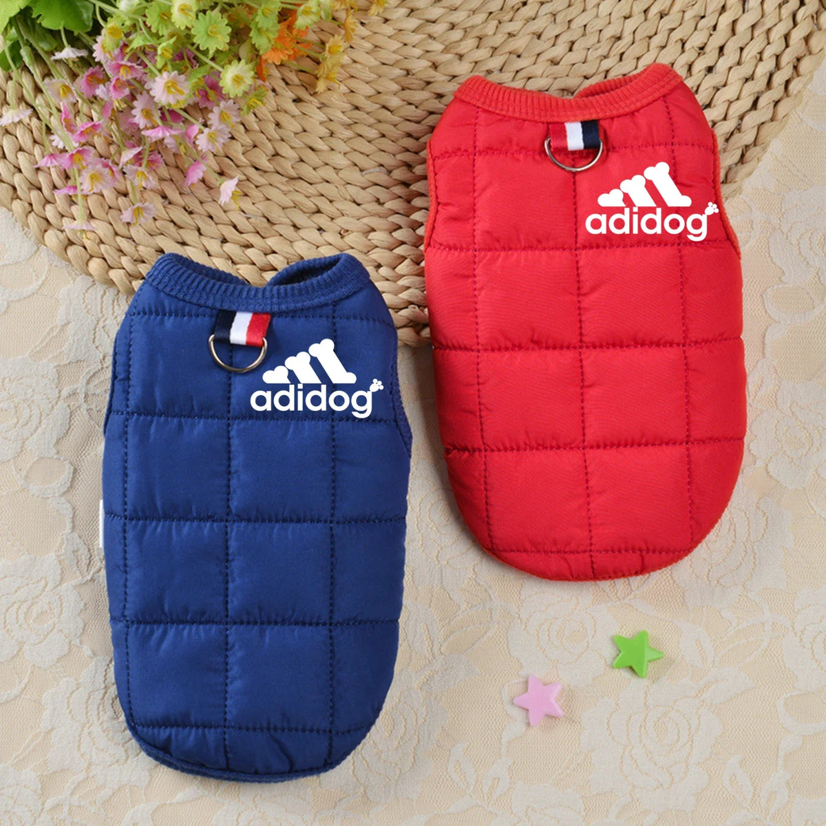 Two puffer dog hoodies, navy blue and red, with hood and adidog logos
