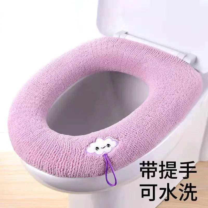 Purple plush toilet seat cover mat with handle, cute animal patch detail.
