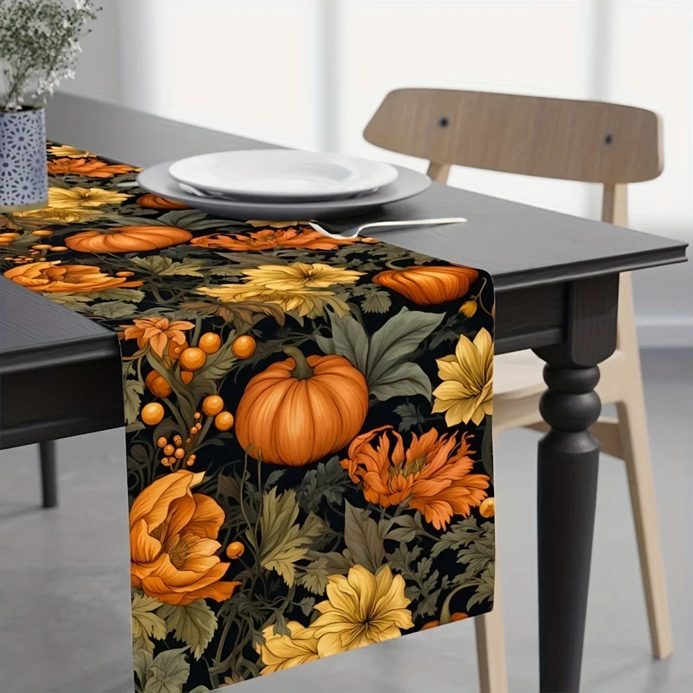 Dark linen table runner with large pumpkin and autumn leaf pattern