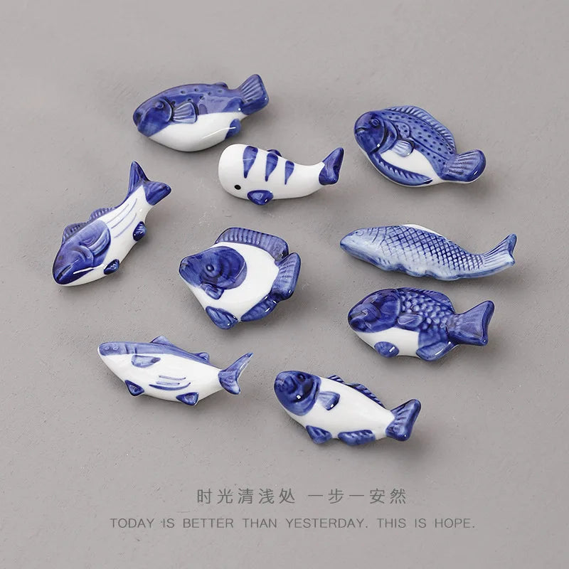Set of ceramic fish chopstick holders in blue and white, multiple pieces for utensils