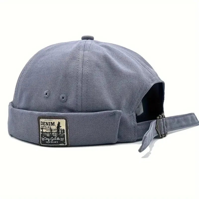 Light blue dome cap with denim logo patch and side strap with metal buckle