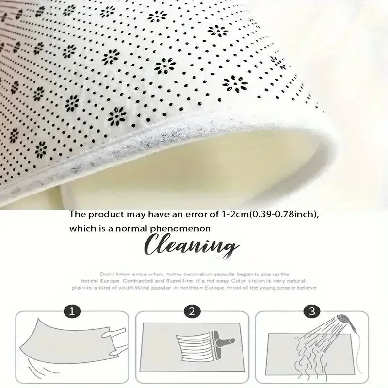 White doormat with scattered black snowflake dot pattern