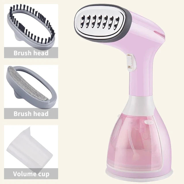 Handheld garment steamer in pink with brush heads and volume cup accessories shown