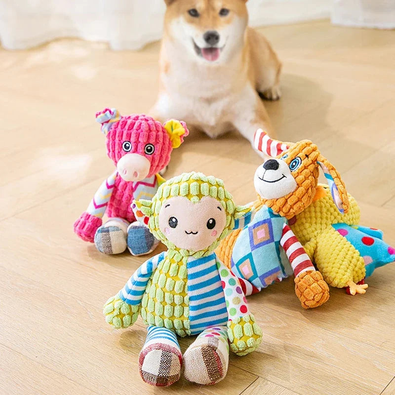 Set of four colorful plush dog toys: striped dog, bug, lion, and tiger characters