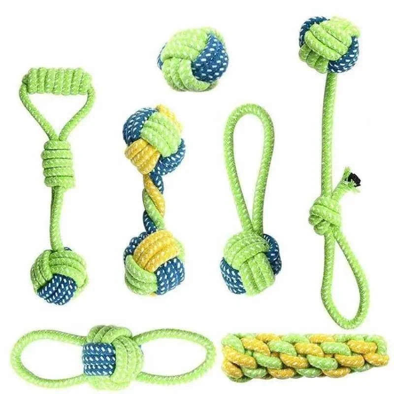Cotton rope dog toy set with green, blue, and yellow braided tug pieces and rope balls