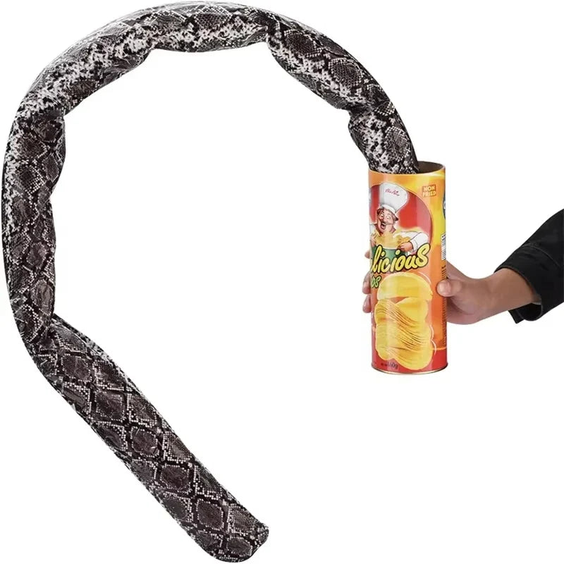 Coiled snake spring prank toy, dark gray with black-and-white scale pattern.
