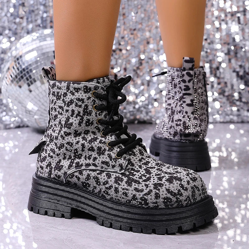 Black-and-white leopard-print lace-up ankle boots from side view, thick sole