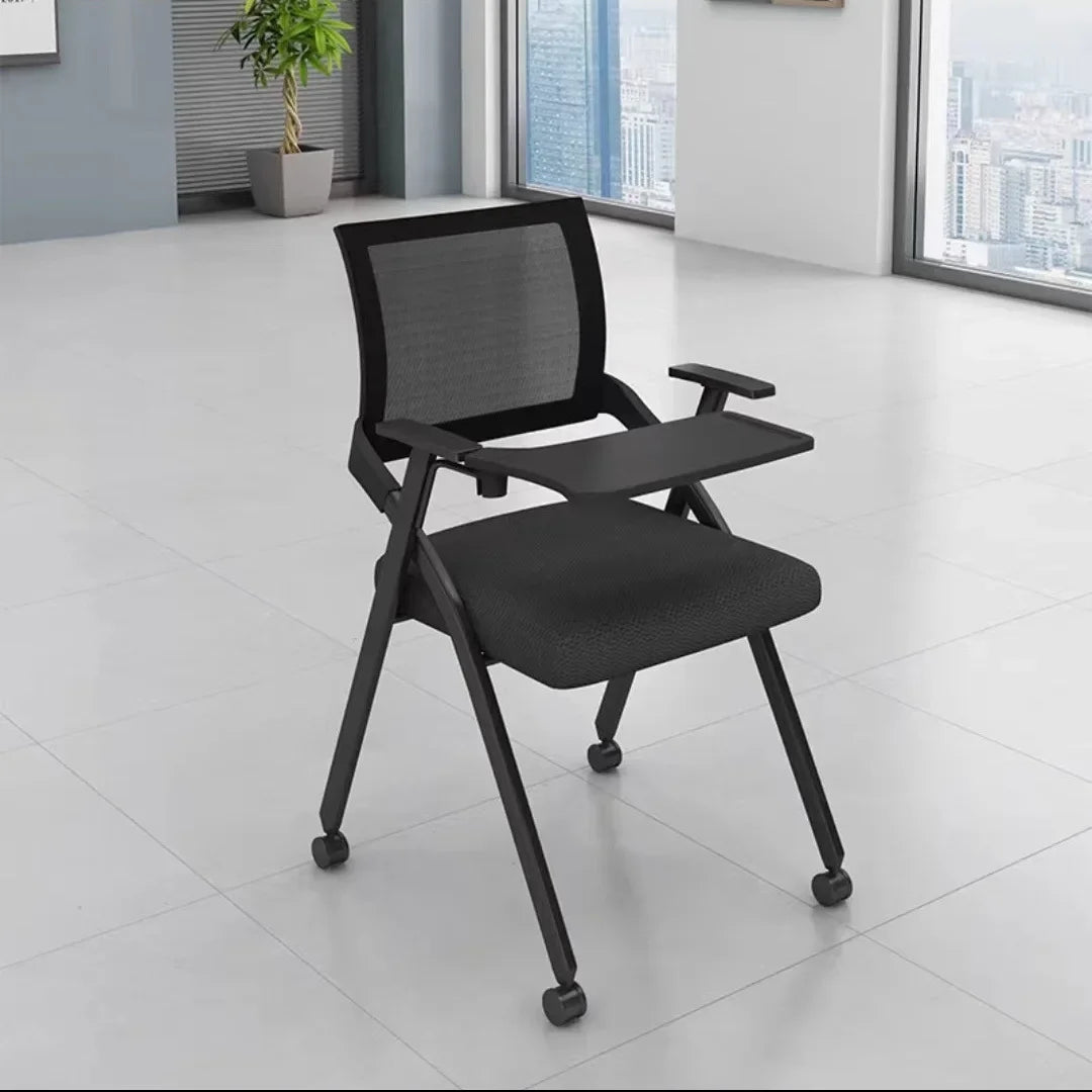 Folding training chair with desk board, dark mesh back, dark cushioned seat, rolling legs