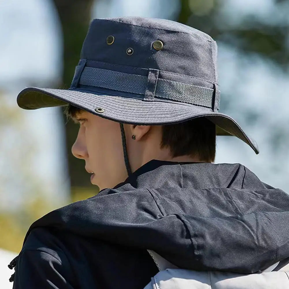 Dark grey wide-brim bucket hat with adjustable band and chin strap, side view