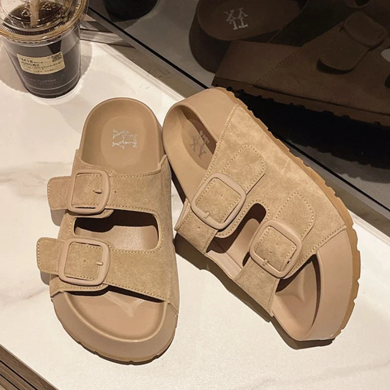 Women’s platform slide sandals with two buckle straps, beige/khaki color.