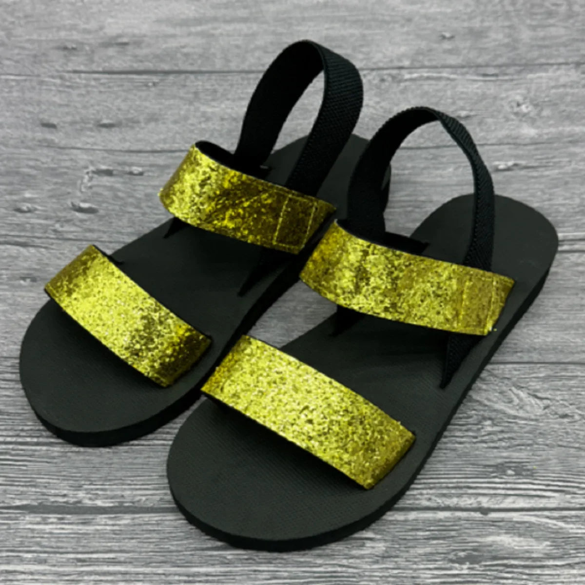 Black platform slip-on sandals with yellow glitter wide straps