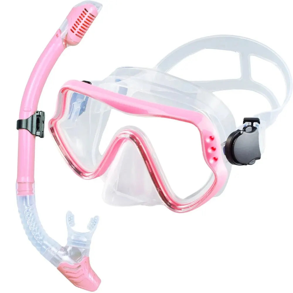 Adults dry snorkeling mask and snorkel set in pink with clear silicone and snorkel mouthpiece.
