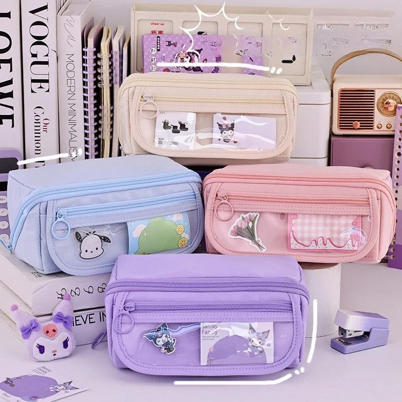 Set of pastel zip pencil cases with cartoon panels, stacked in storage display