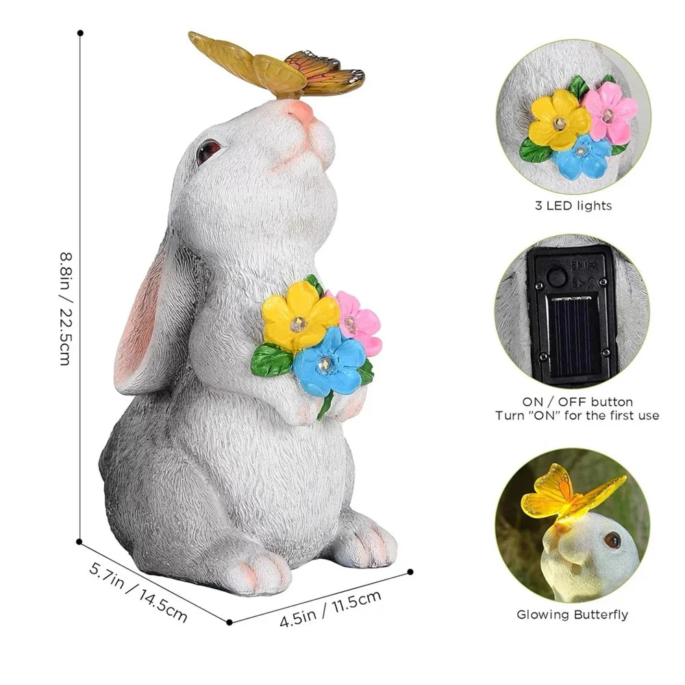 Standing rabbit statue with butterfly topper, three LED lights, and flower bouquet detail