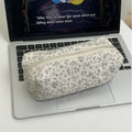Floral canvas pencil case with cream base and navy allover flower print