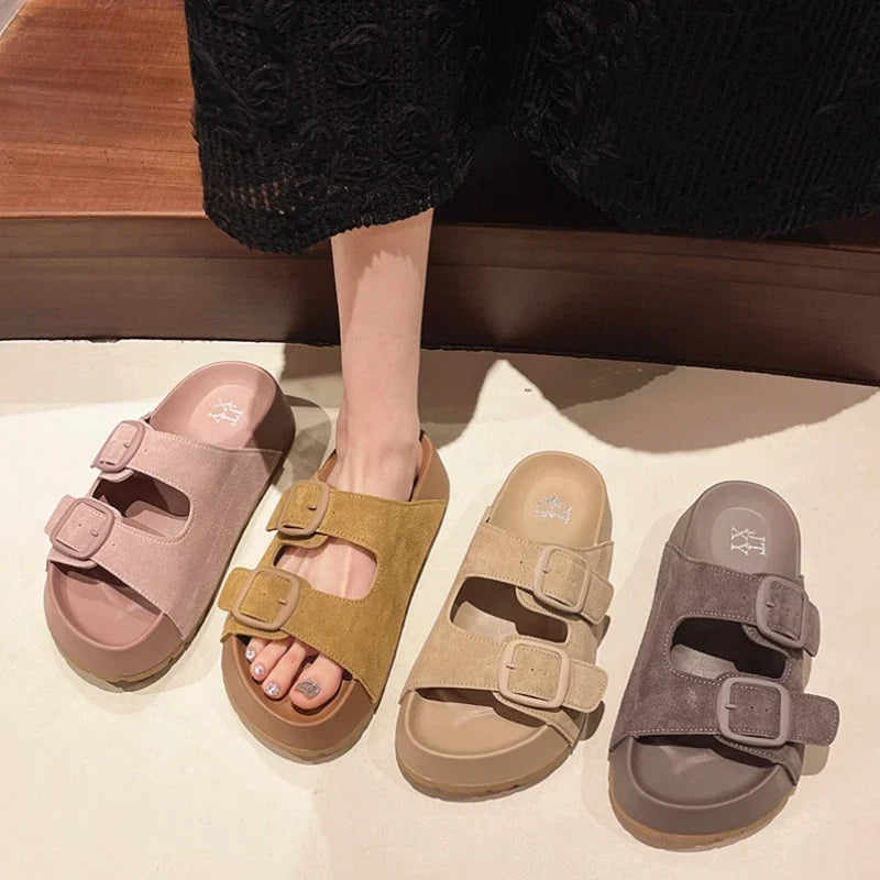 Women’s platform slide sandals, assorted colors with double buckle straps.