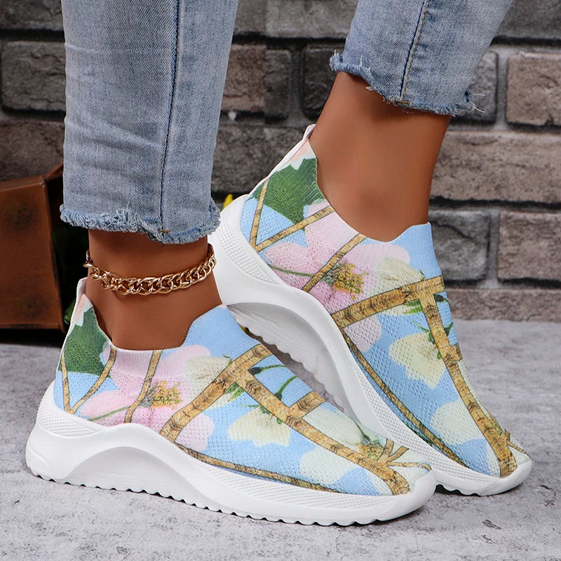 Multicolor platform slip-on sneakers with blue and green print, gold cross strap, white sole