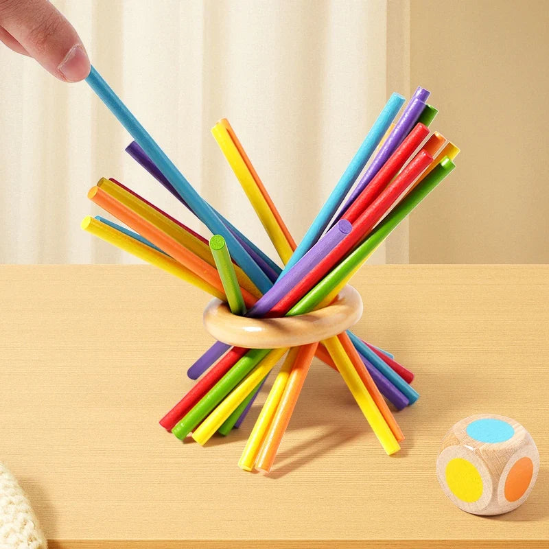 Colorful wooden sticks bundled in a ring with two wooden dice