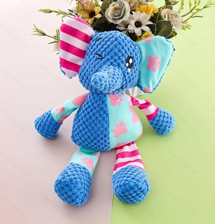Blue elephant plush dog toy with striped legs, smile face, and patterned ears