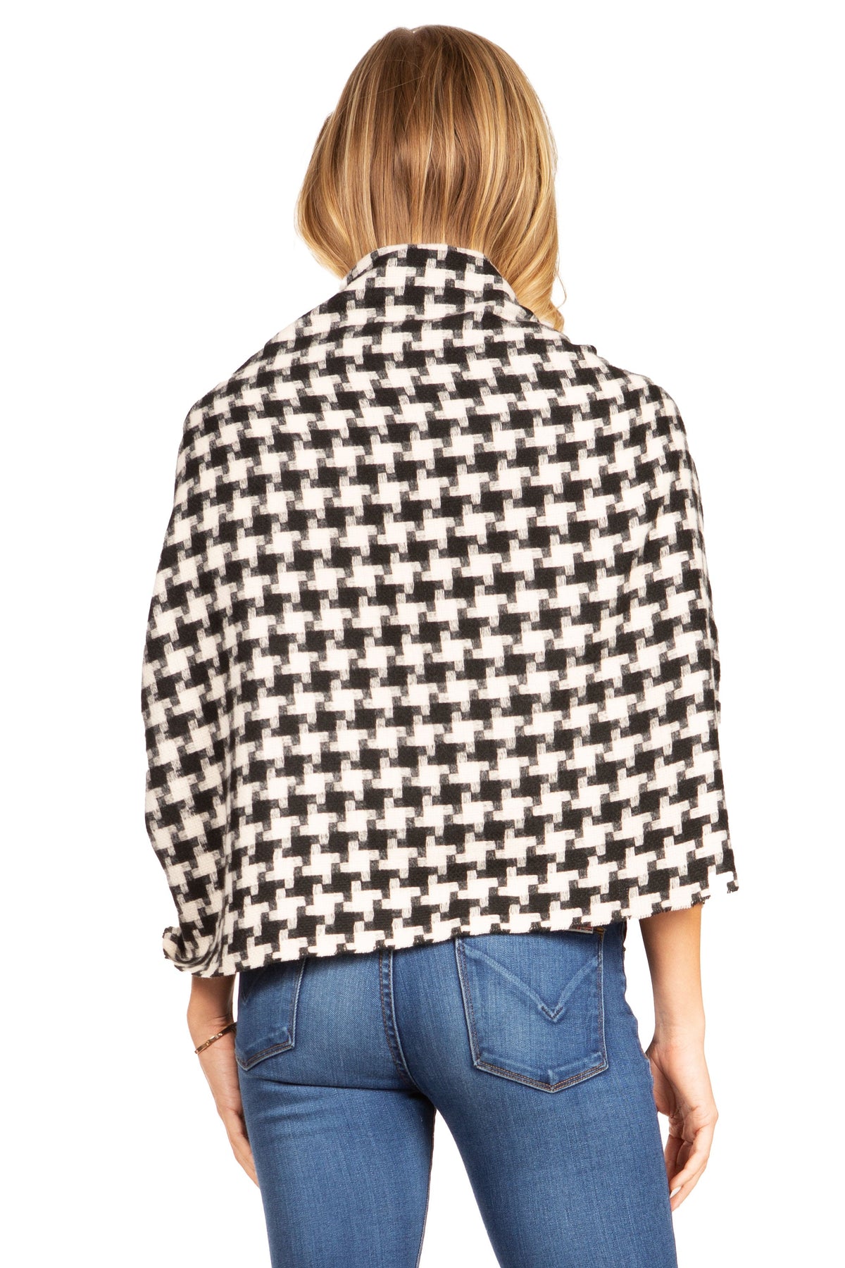 Black-and-white houndstooth pashmina shawl with fringe, draped on model