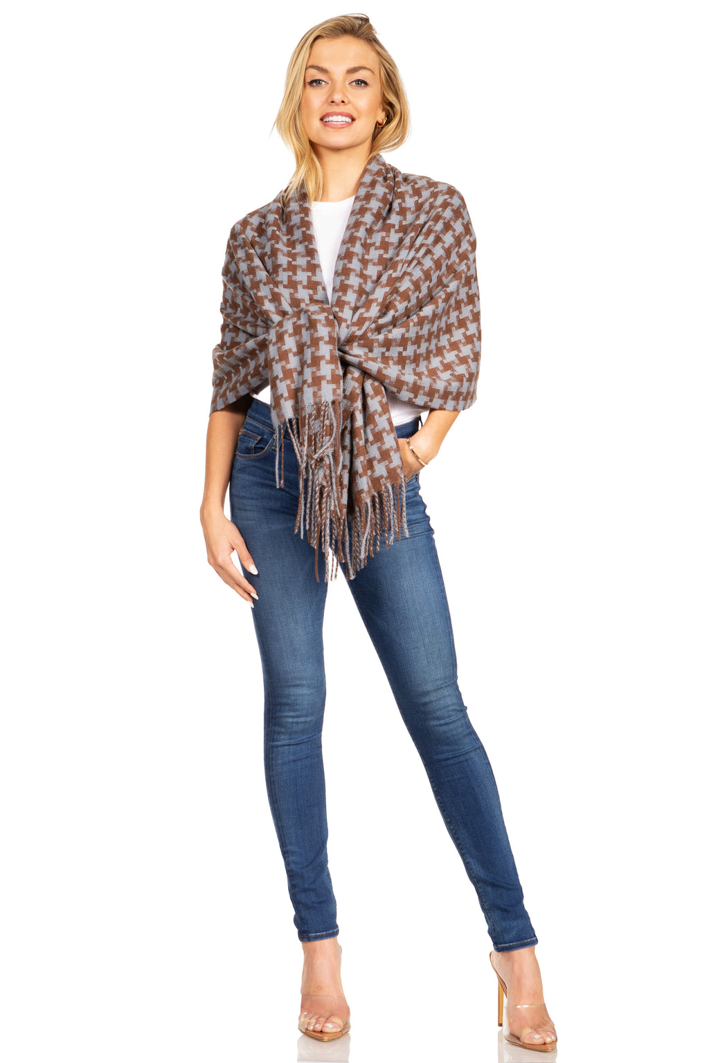 Brown-and-tan houndstooth pashmina shawl with fringe, tied at front over jeans