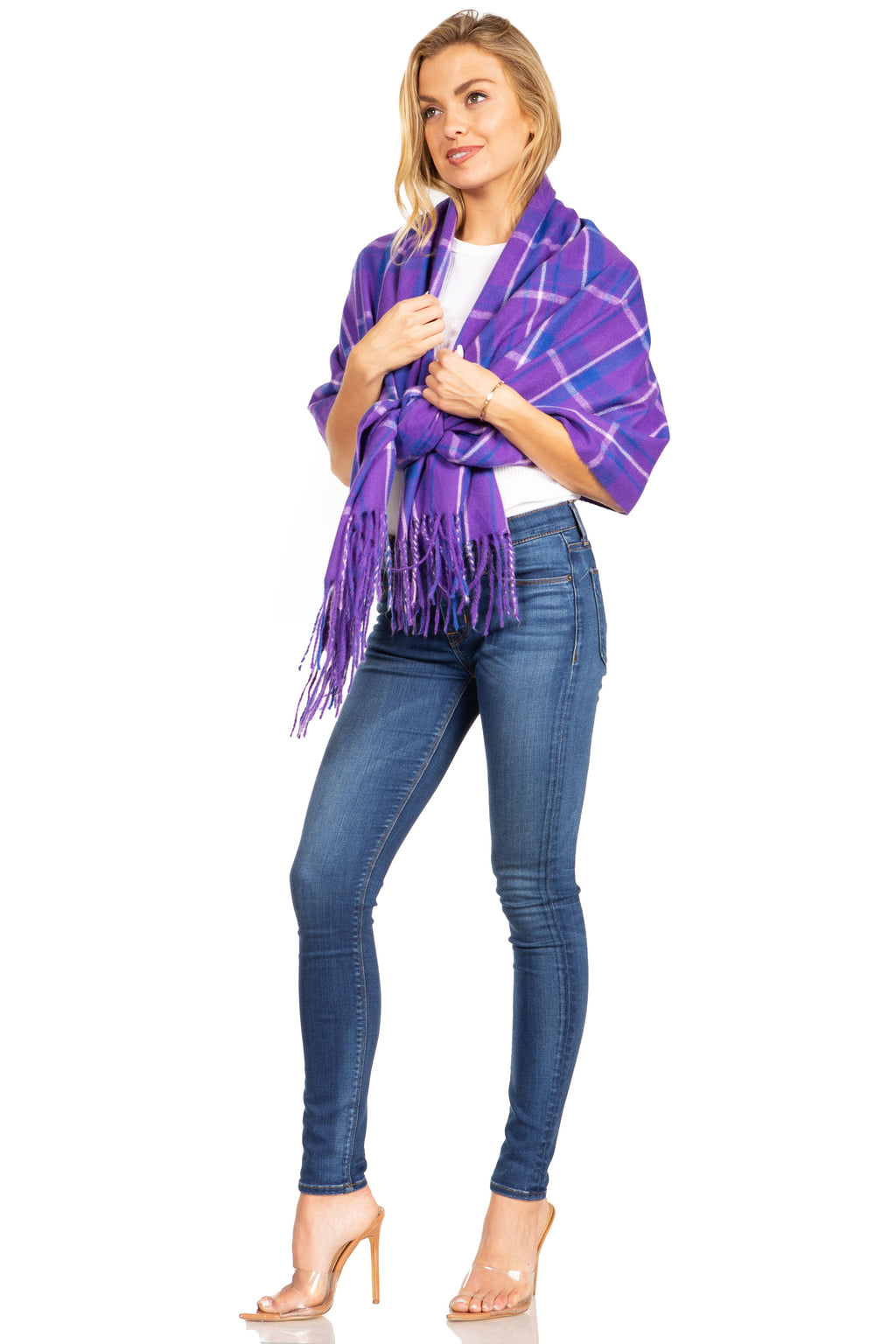 Purple plaid pashmina shawl with long fringe ends, tied wrap styling over jeans