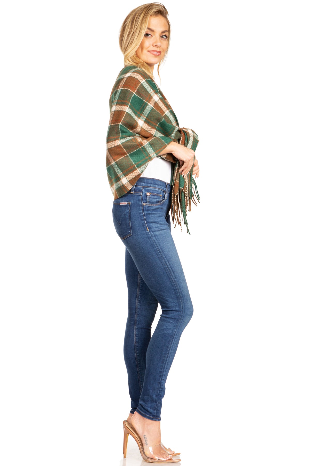 Plaid pashmina shawl wrap in green and tan with fringed ends, tied at the front