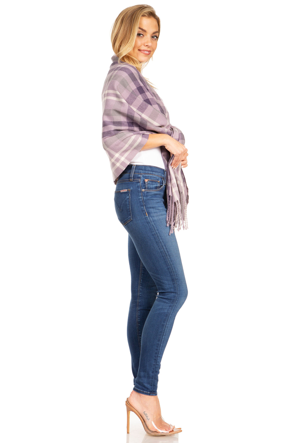 Plaid pashmina shawl wrap scarf in lilac and purple tones, draped over shoulder with fringe