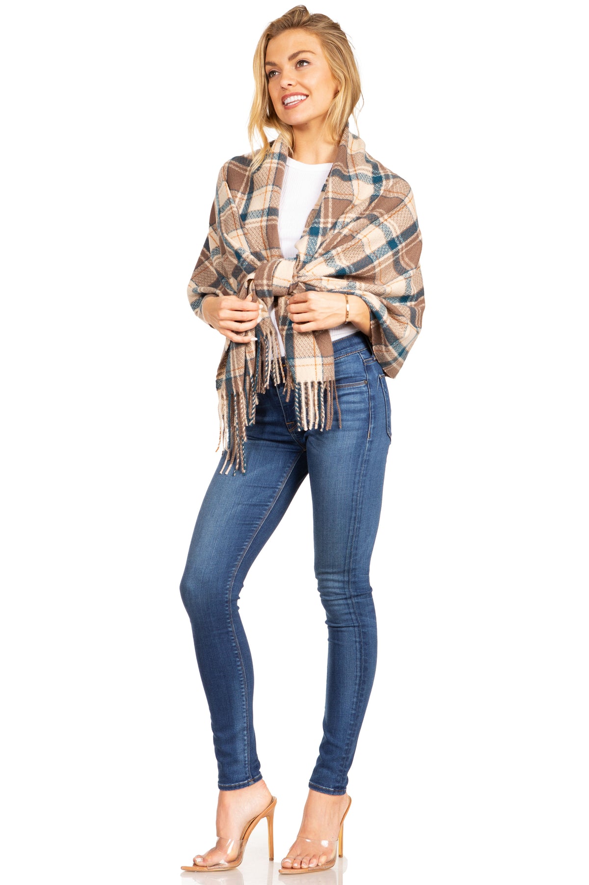 Camel plaid pashmina shawl scarf with fringe trim, tied wrap style over jeans