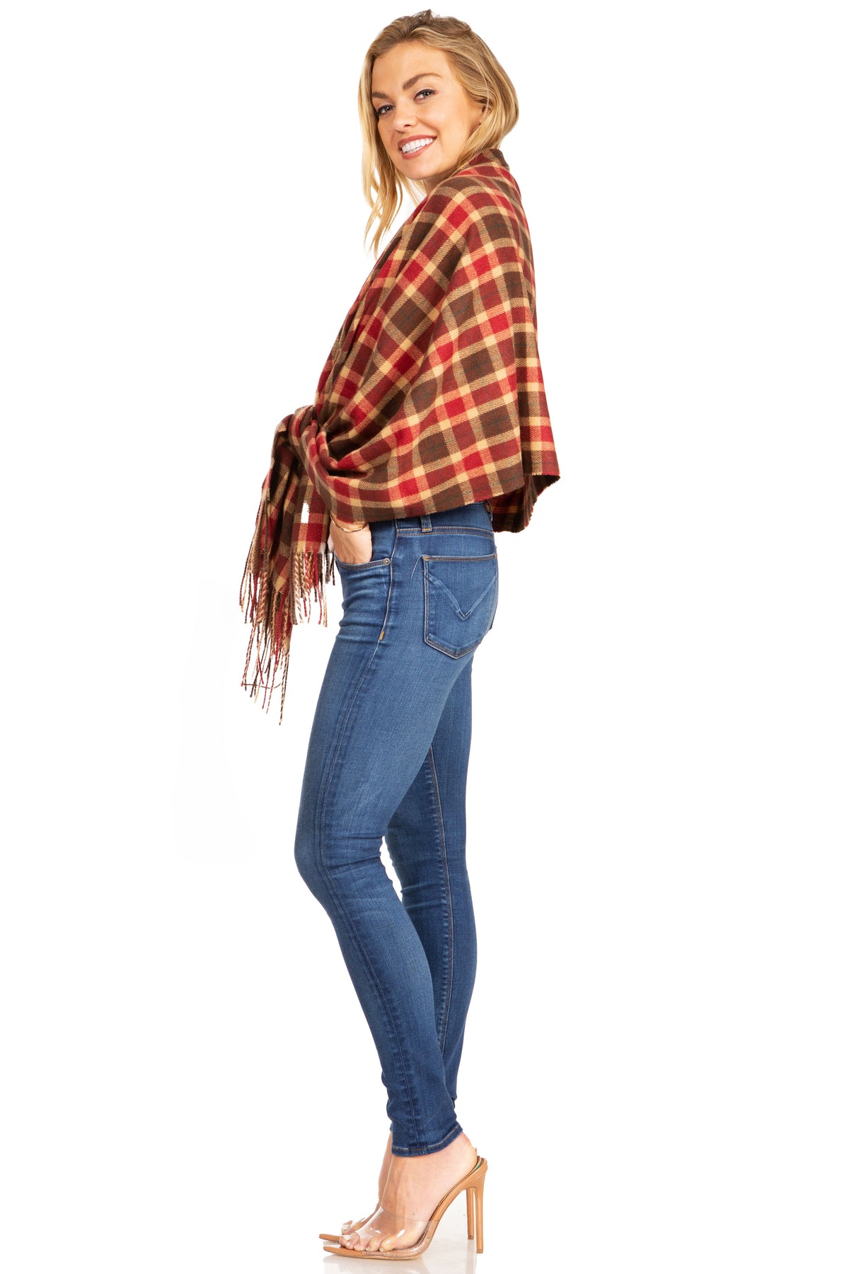 Red and brown plaid pashmina-style shawl with fringe, worn to the side