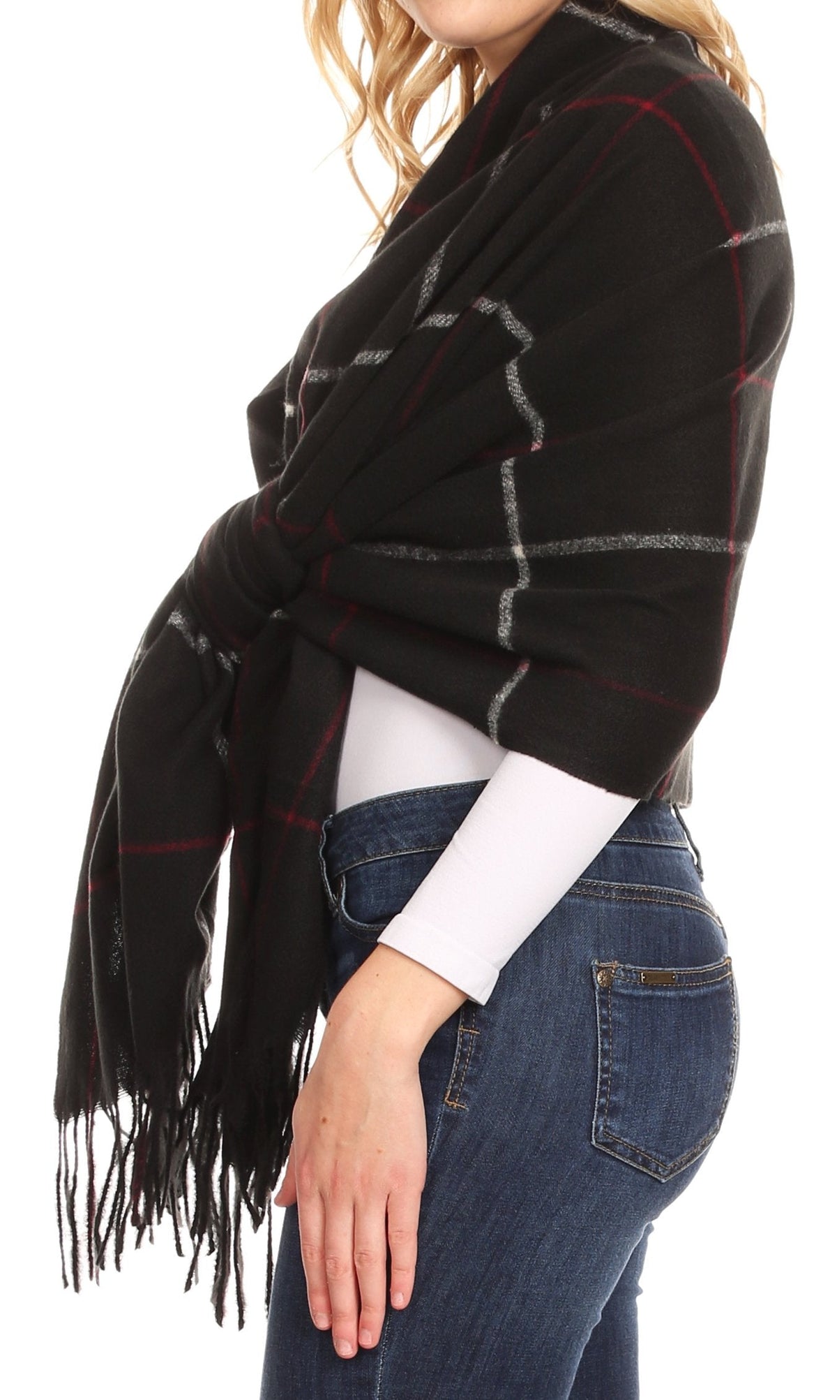 Black plaid wrap shawl with fringe, red and gray lines, worn around the neck
