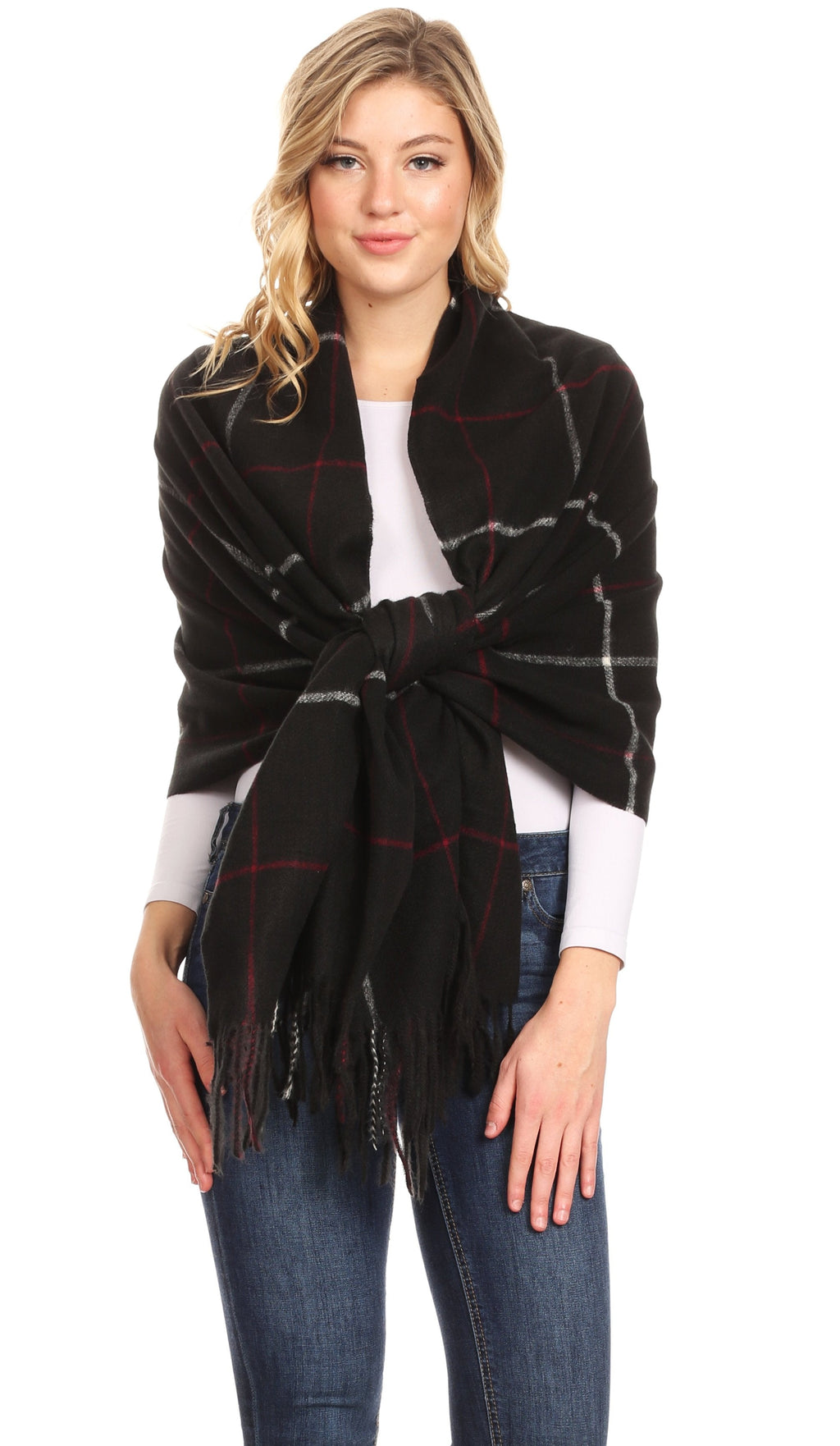 Black plaid shawl with fringe and red-gray lines, wrapped around the shoulders