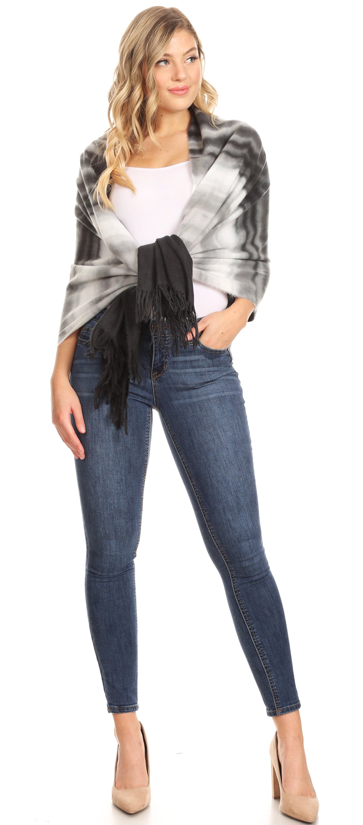 Women's black-and-gray striped pashmina shawl with long fringe, draped over shoulders