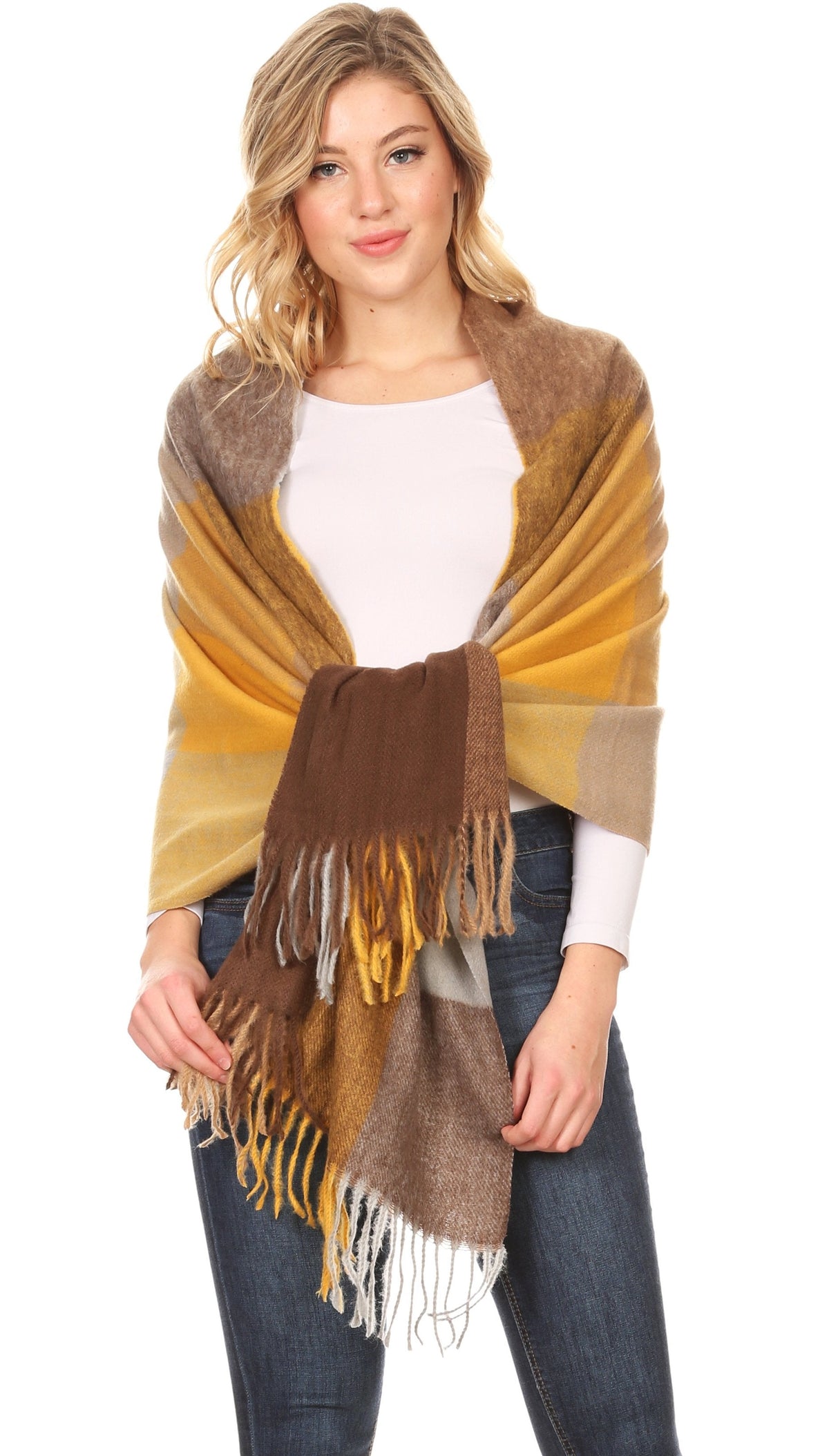 Women’s pashmina shawl wrap scarf with yellow, brown, and cream plaid blocks and fringe.