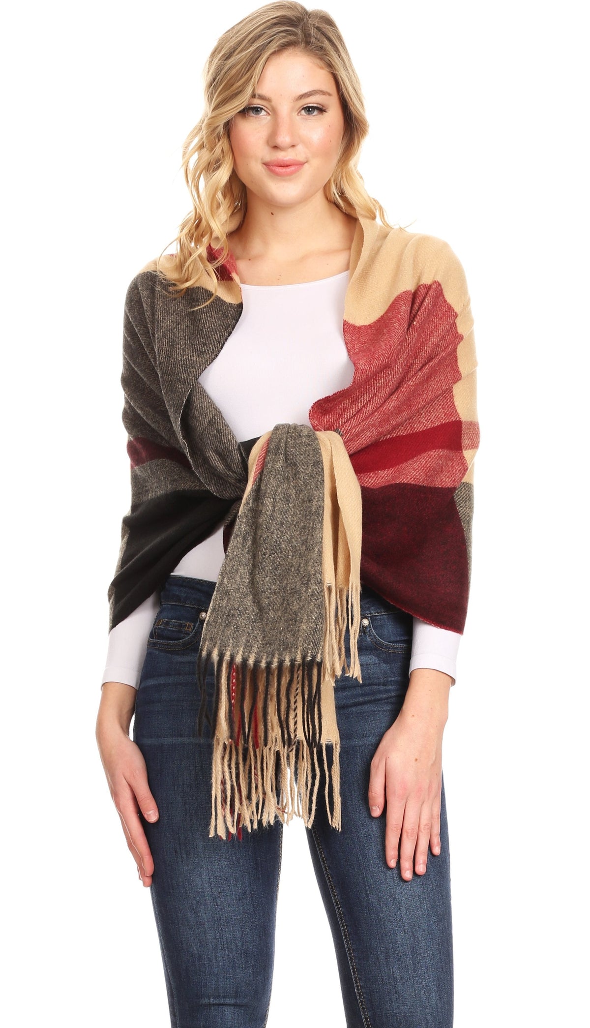Women’s pashmina shawl wrap scarf in brown, cream, and red plaid with long fringe.