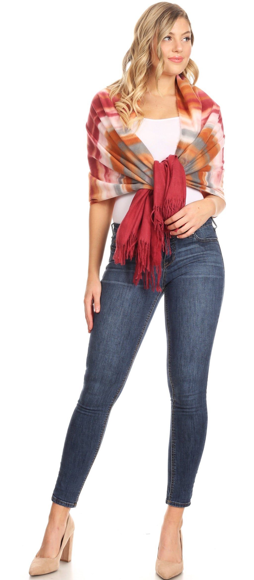 Orange and rust plaid pashmina shawl scarf with fringed ends tied at front