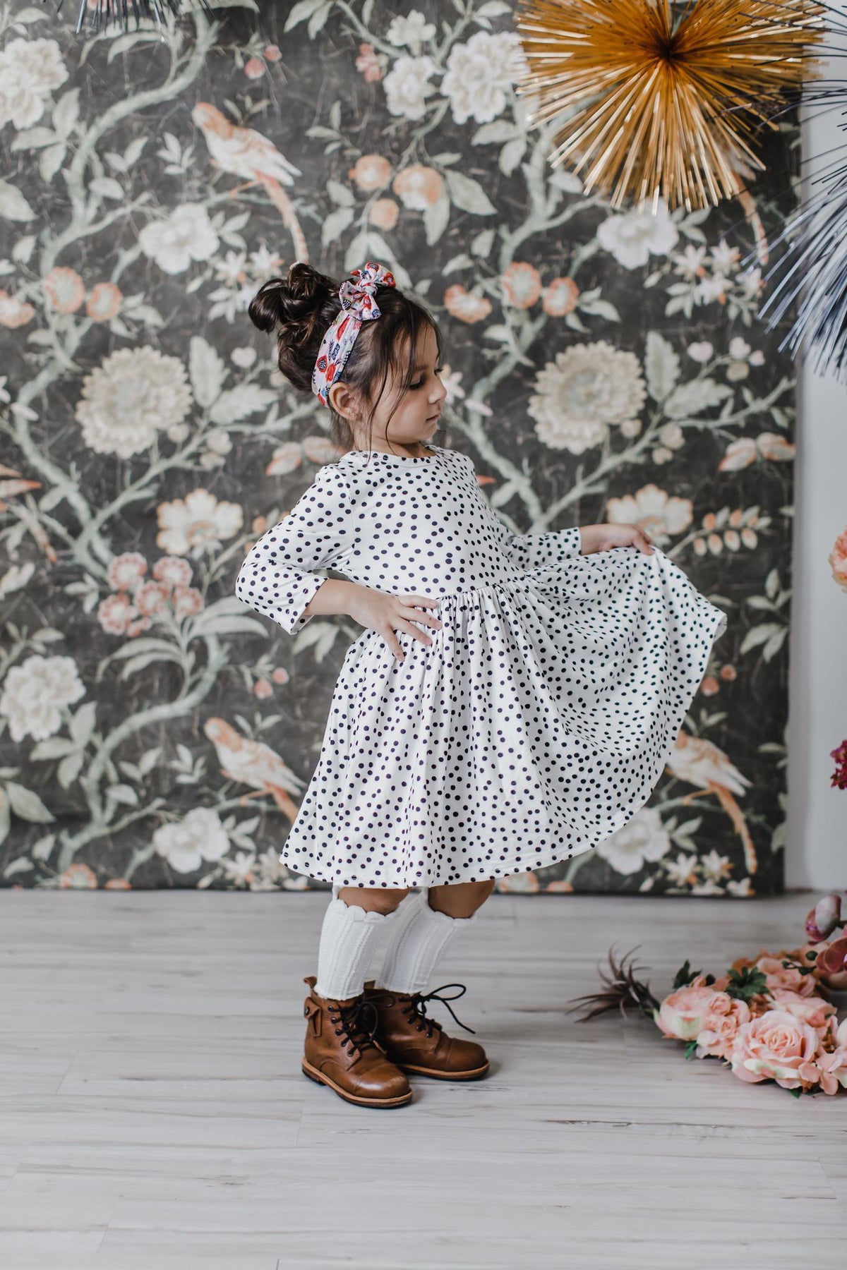 White polka-dot 3/4 sleeve twirl dress with gathered waist and full skirt