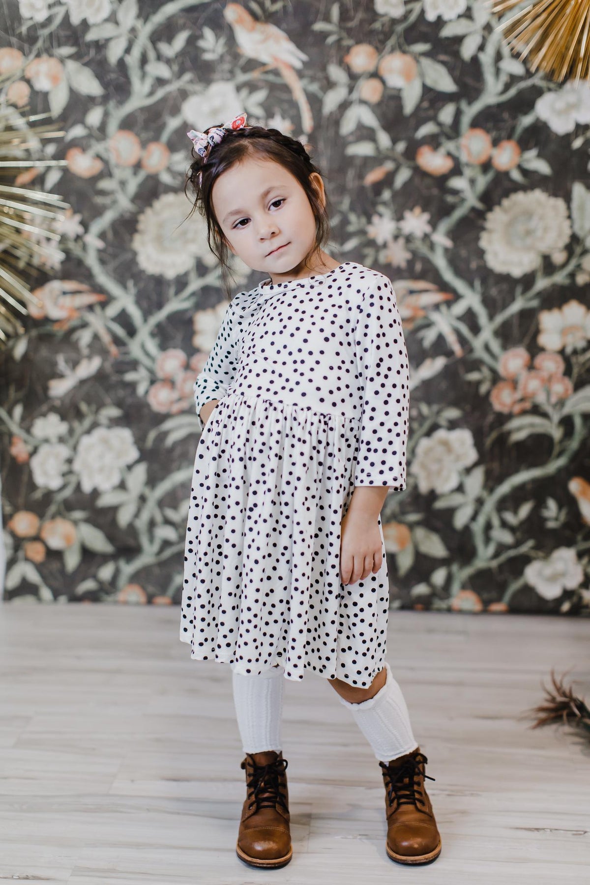 White polka-dot twirl dress with 3/4 sleeves and knee-length gathered skirt