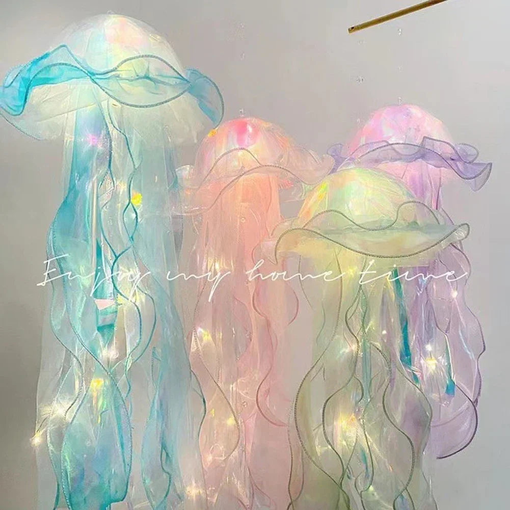 Jellyfish lantern hanging lamp trio with soft multicolor glow on translucent fabric