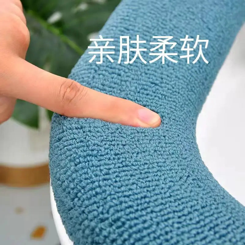 Blue plush toilet seat cover mat, textured surface close-up