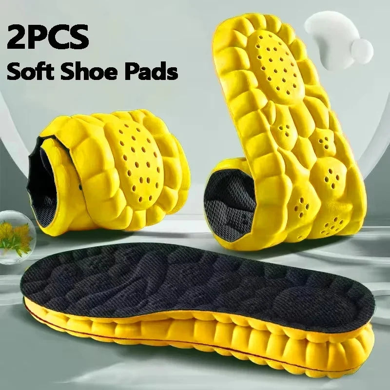 Yellow sports insoles with perforated cushioning and shock-absorbing soft pads