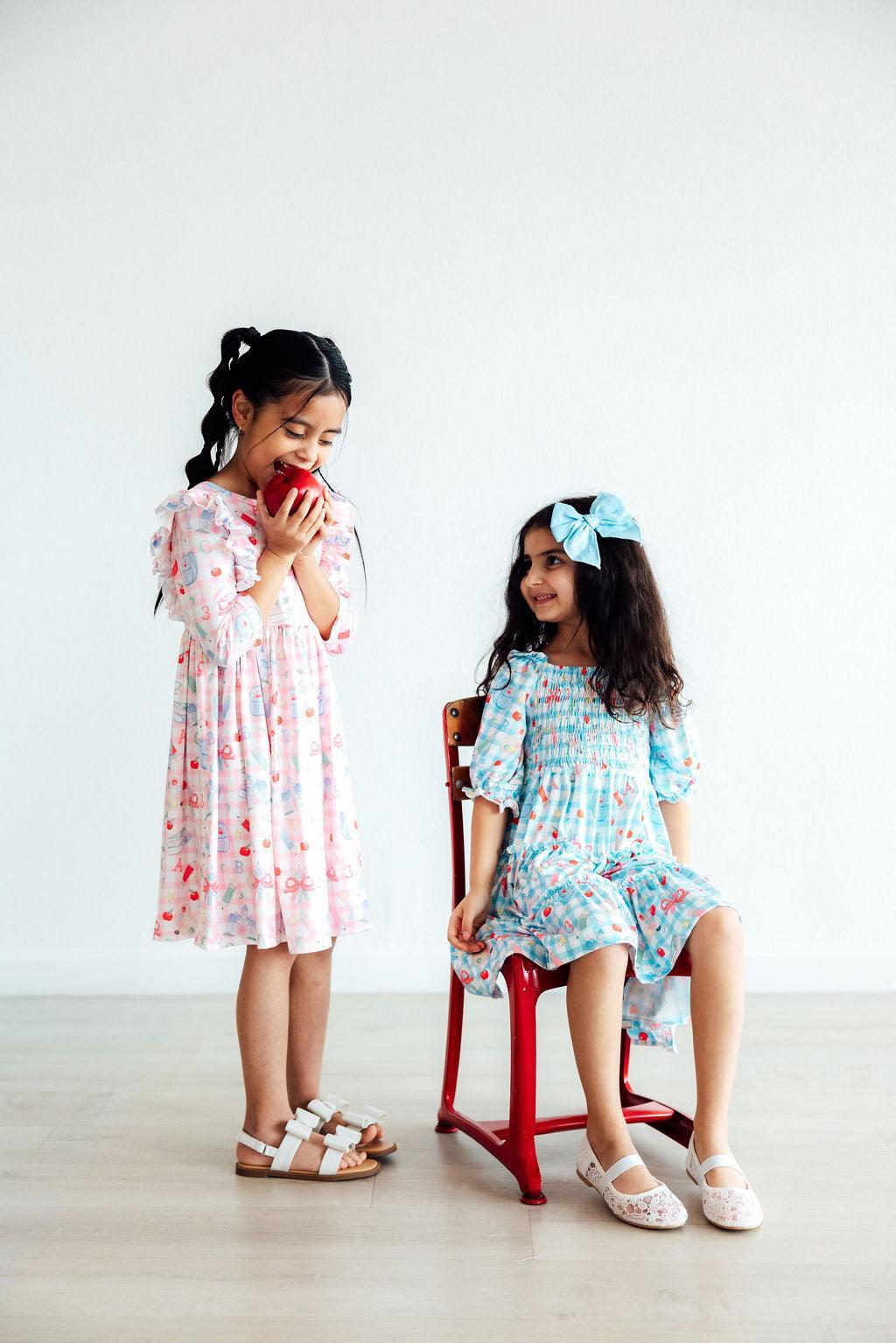 White and light blue printed 3/4 sleeve ruffle twirl dresses with gathered twirl skirt
